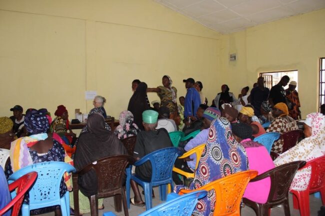 People sitting and standing in building