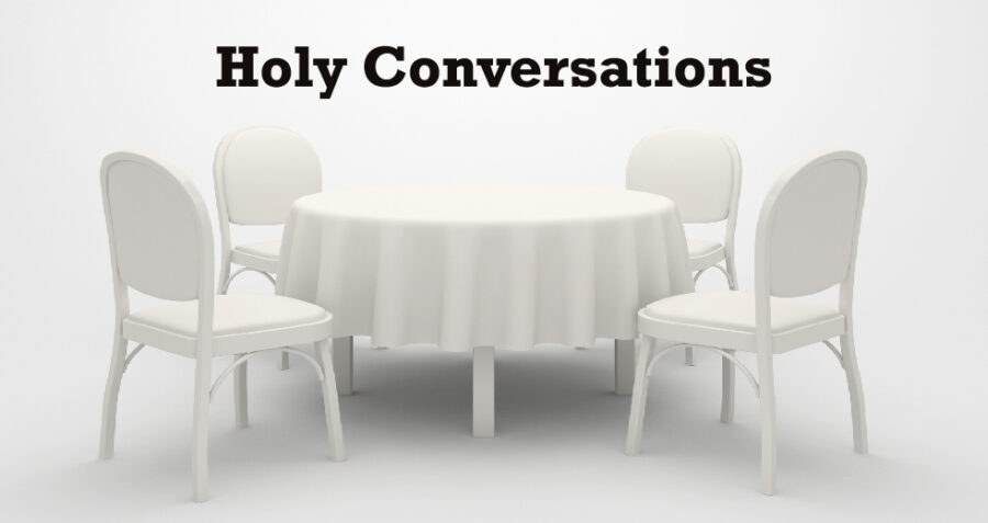 Holy Conversations written above an all-white, round table with four chairs